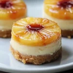 Mini pineapple upside-down cheesecake with caramelized pineapple and cherry center