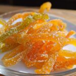 Close-up of candied orange and lemon strips coated in sparkling sugar, representing Classic Mixed Peel (Orange + Lemon).