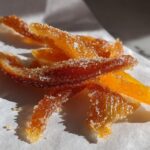 Close-up of candied orange peels generously coated in sparkling sugar, showcasing the Mixed Peel with Brown Sugar recipe.