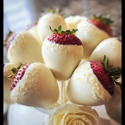 Close-up of fresh strawberries partially dipped in white chocolate, arranged in a White Chocolate Strawberry Bouquet.