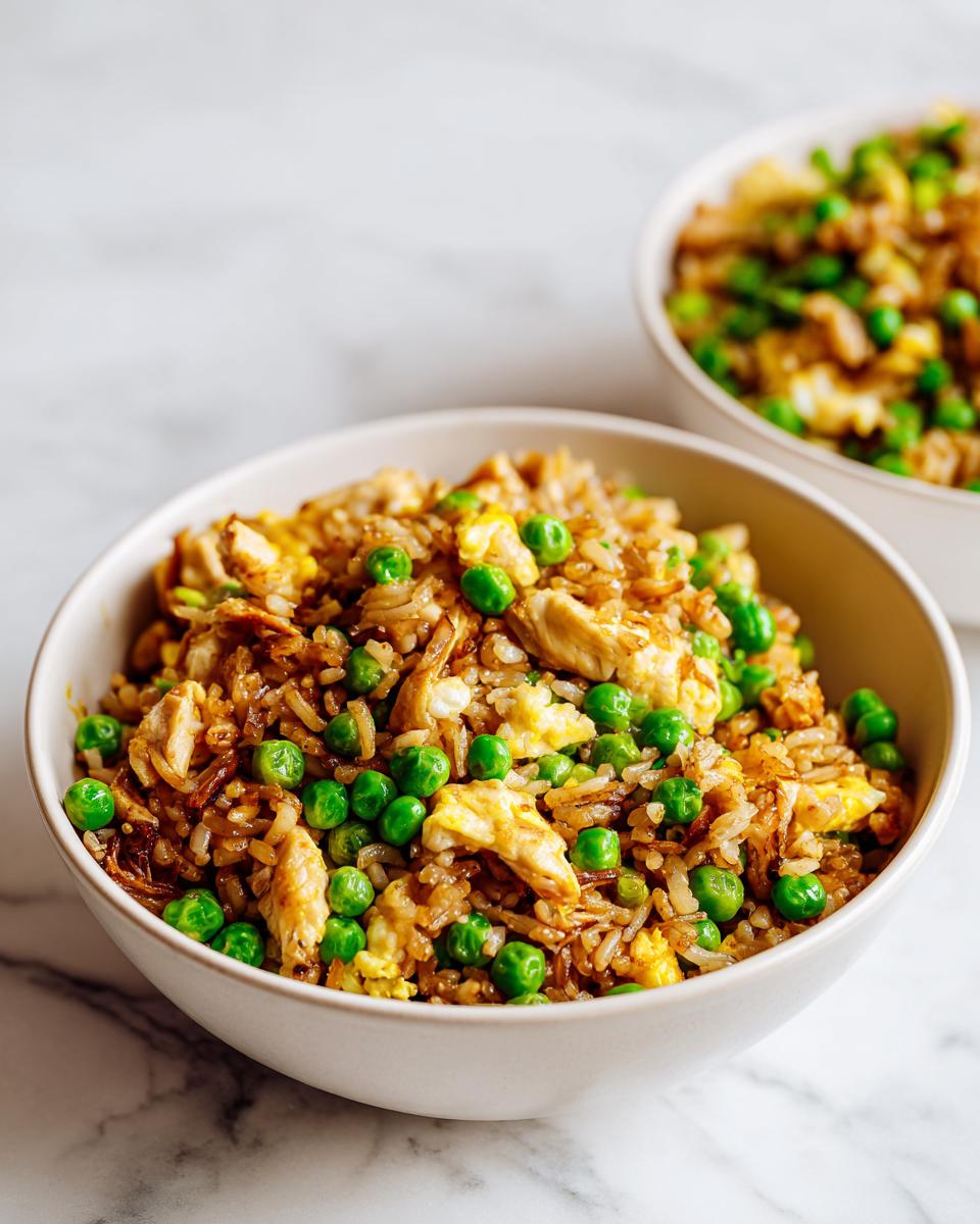 Close-up of chicken fried rice with bright green peas and scrambled egg, perfect for an Easy Summer Rice Dinner.